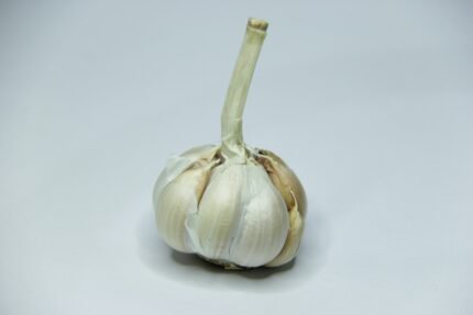 a close up of a garlic on a white background